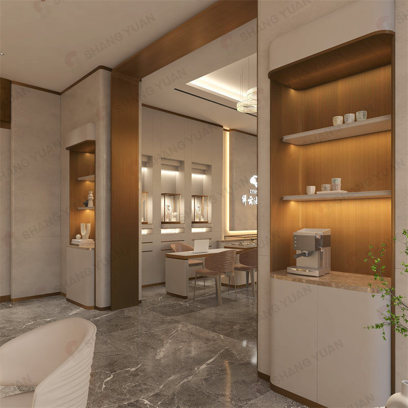 Elegant partition wall design with warm wooden inset shelves separating fine jewelry display zones